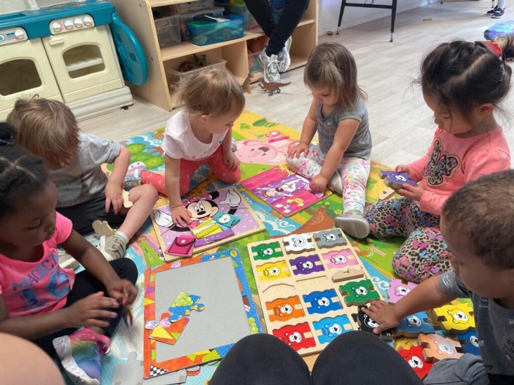 children playing with puzzles together