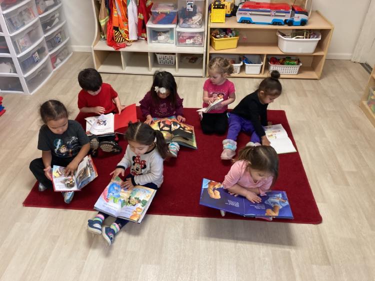 child creating with paper and crafts